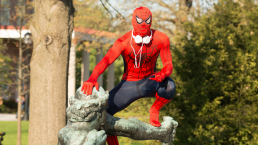 student in Spiderman costume