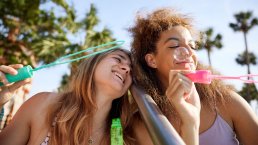 students blowing bubbles