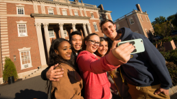 group of students on campus taking a selfie