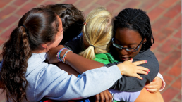 group of students hugging