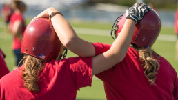 girls playing softball