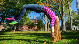 student doing a back flip