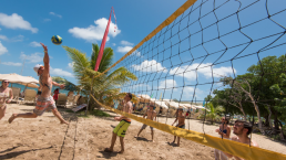 students playing beach volleyball