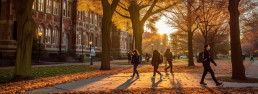 College campus in the fall with students walking around